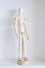 wooden mannequin on desk