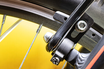 Brake on a bicycle wheel. Sports bike design element. Spot and technology. Close-up. Leisure