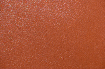 Brown and beige color leather background texture. Close up wallpaper