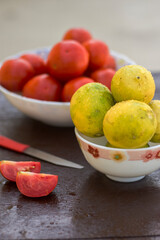 yellow organic lemons in a bowl