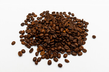 Roasted coffee beans pile isolated on white background. top view