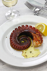 grilled octopus with lemon and olive oil, miditerranean cuisine ( Greece, Italy, Spain)