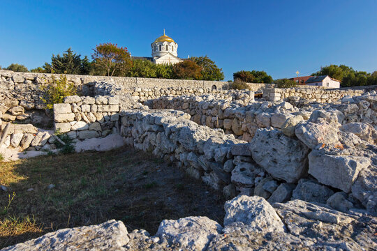 Tauric Chersonesus. Ruins of an ancient city on the beach at sunset. Ruins, antique columns. Vladimir cathedral. 