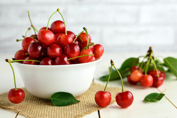 Fresh cherries in white bowl