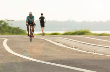 Fototapeta premium Images blur the concept of the activities of bicycle and athletic