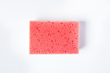 bathing sponge on a white background. Means for bathing in the bathroom. Photo above
