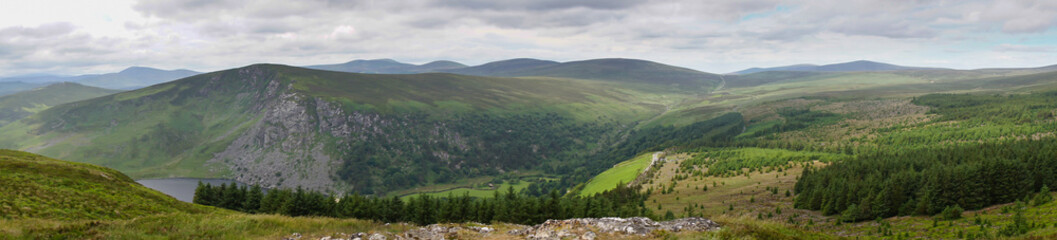 Panoramic view of Wicklow Mountains. This place is famous for uncontaminated nature, misty landscapes and lakes. Panoramic view during summer time