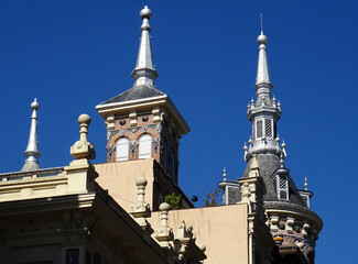 Obraz premium Historic colorful architecture in the old city center of Madrid. Details of the roofs and spires. Spain. 