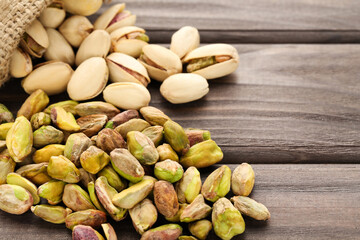 Tasty pistachios on wooden table