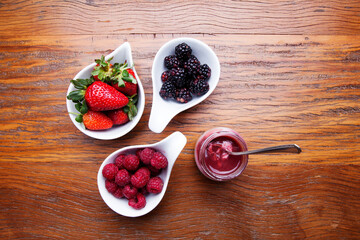 Nutrition concept - Healthy cheese cake in glass jars over wooden background. Healthy food, Diet, Detox, Clean Eating or Vegetarian concept. Delicious dessert option.