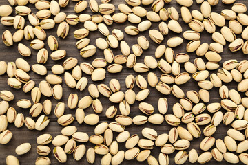 Tasty pistachios on wooden table