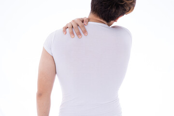 A man feeling exhausted and suffering from shoulder and neck pain and injury on isolated white background. Health care and medical concept.