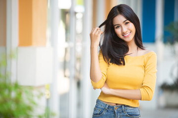 Fototapeta premium hipster woman walking on the street, wearing cute trendy outfit