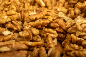 Peeled walnuts loose surface texture. Healthy diet. Fitness diet. Close up.