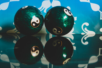 Close-up of a Chinese yin yang balls, 
harmony of the world and the universe, Qigong balls with yin...