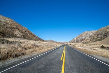 Beautiful highway road with mountain in rural on day time.