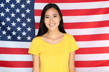 Young woman on American flag background