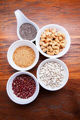 Nutrition concept -Healthy grains food selection in round bowls over wooden background. Healthy food, Diet, Detox, Clean Eating or Vegetarian concept