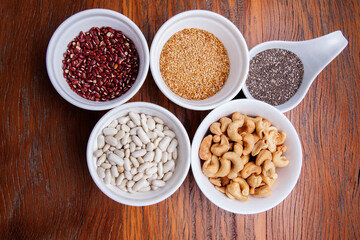 Nutrition concept -Healthy grains food selection in round bowls over wooden background. Healthy food, Diet, Detox, Clean Eating or Vegetarian concept