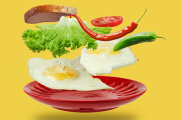 Sunny side up fried egg with slice of bread and vegetables over the red plate