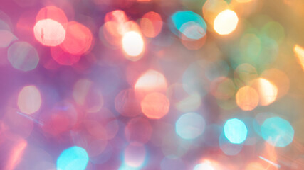 Multicolored defocused bokeh lights background - horizontal wallpaper, poster. Stylish, festive and elegance shot. Trendy colors. Illuminated, lights, glitter effects. Celebrative decoration.