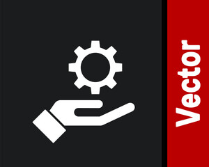 White Settings in the hand icon isolated on black background.  Vector Illustration