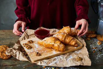 Girl holding colorful French macarons in hands
