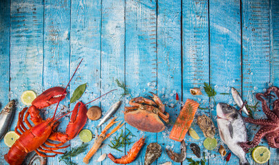 Fresh tasty seafood served on old wooden table. Top view. Close-up.