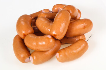 Tasty meat sausages over white background