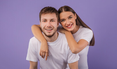 Portrait of beautiful young couple smiling at studio