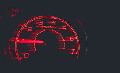 Driver's cockpit ; speedometer on dashboard - colorful light in black, copy space for your abstract...