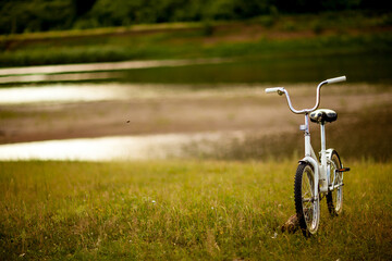 Fototapeta na wymiar Autumn. Bike and puddles.