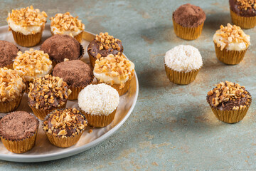 Brigadeiro is a common Brazilian dessert. Delicious chocolate candy Brigadeiro on a table