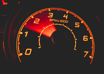 Driver's cockpit ; speedometer on dashboard - colorful light in black, copy space for your abstract design	