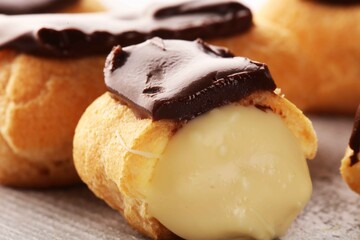 Traditional French dessert. Eclair with chocolate icing. Pastery dessert concept