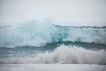 Fototapeta premium wild windy waves in the Atlantic ocean, with the white foam and splashes