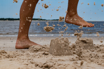 kicking sand castle © Ian