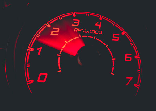 Driver's cockpit ; speedometer on dashboard - colorful light in black, copy space for your abstract design	