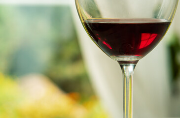 A glass of red wine in an isolated background. close up