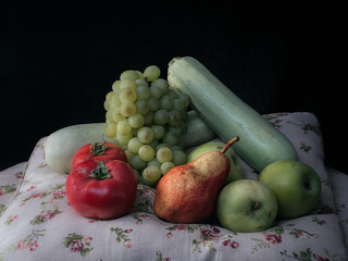 Stillife of natural and ecological vegetables and fruits on black background.