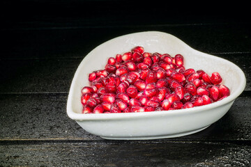 grains garnet in dish on black