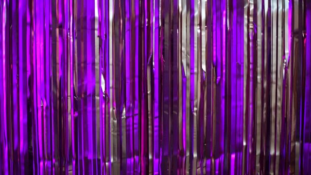 Moving silver and purple, violet glamour fringe background, duzzling tinsel for text, titles, party, holiday, social media content, presentation, shining sparkling lines texture