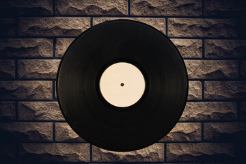 Gramophone record in the background of the stone walls