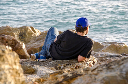 Young man looking at the sea
