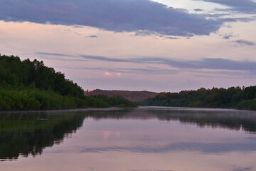 Obraz na płótnie Canvas colorful dawn on a small river