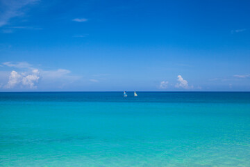 Fototapeta na wymiar boats sailing in blue sea of Varadero, Cuba