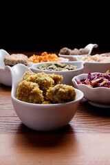 Nutrition concept - Healthy meals in white bowls over wooden background. Healthy food, Diet, Detox, Clean Eating or Vegetarian concept. 