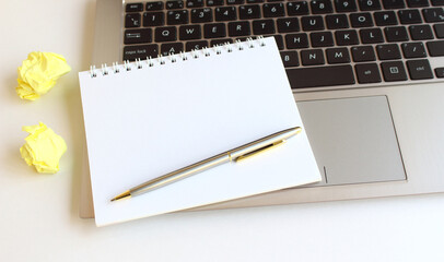 Modern workspace with notebook, tablet and laptop copy space on white color background. Top view. Flat lay style.