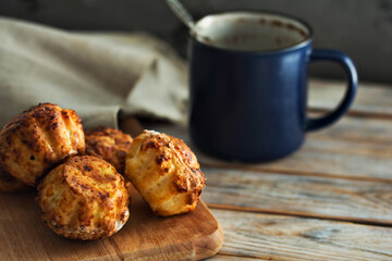Homemade cake and cup of coffee on white plank wooden background. Cupcakes with curd. Delicious dessert. Breakfast concept.