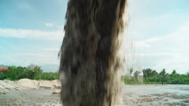 Wastewater from Large Rust Pipe Merge into Environment on the background of the Forest. Sewage from the Sewer Pollutes Terrain. Environmental Pollution. Ecological Catastrophy